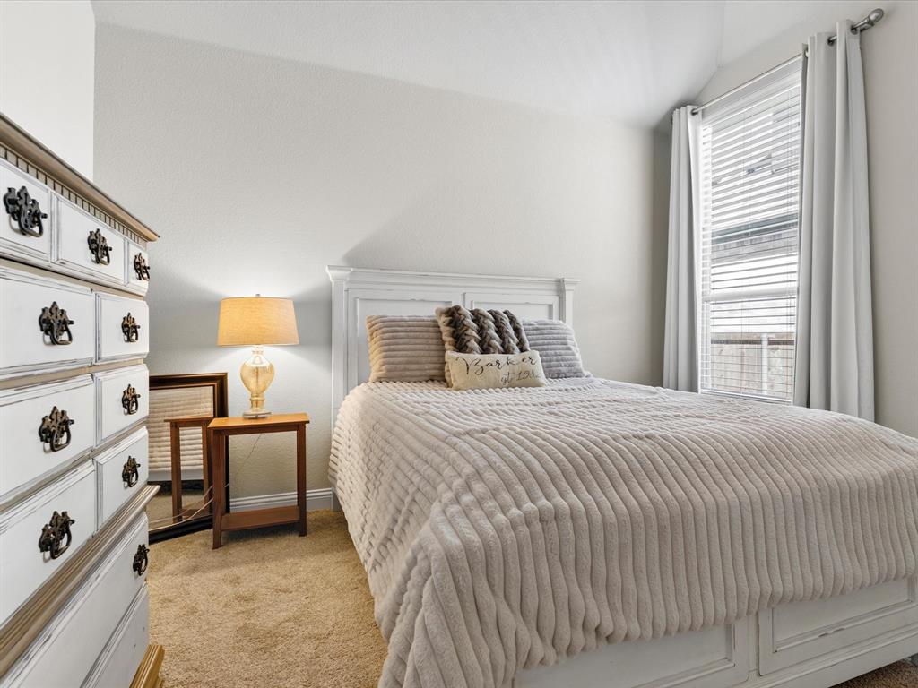 1630 Pebblebrook Lane Prosper, TX 75078 - Photo 10 of 40 a bedroom with a bed and a window