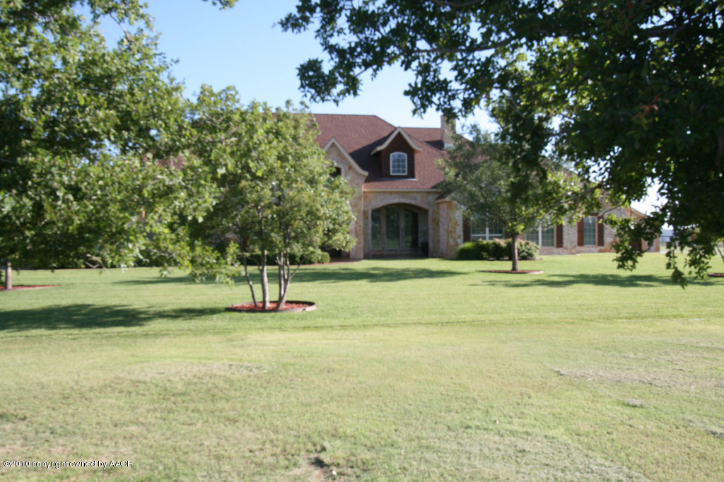 9000 Blackhawk Road Amarillo, TX 79119 - Photo 2 of 39 a front view of a house with a yard