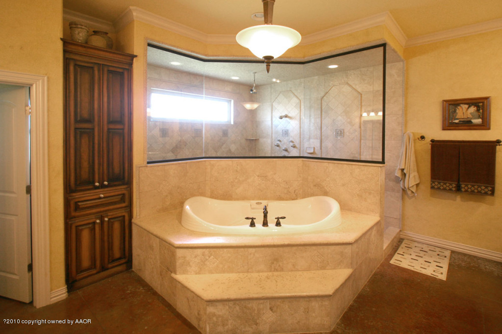 9000 Blackhawk Road Amarillo, TX 79119 - Photo 18 of 39 a bathroom with a sink and a mirror