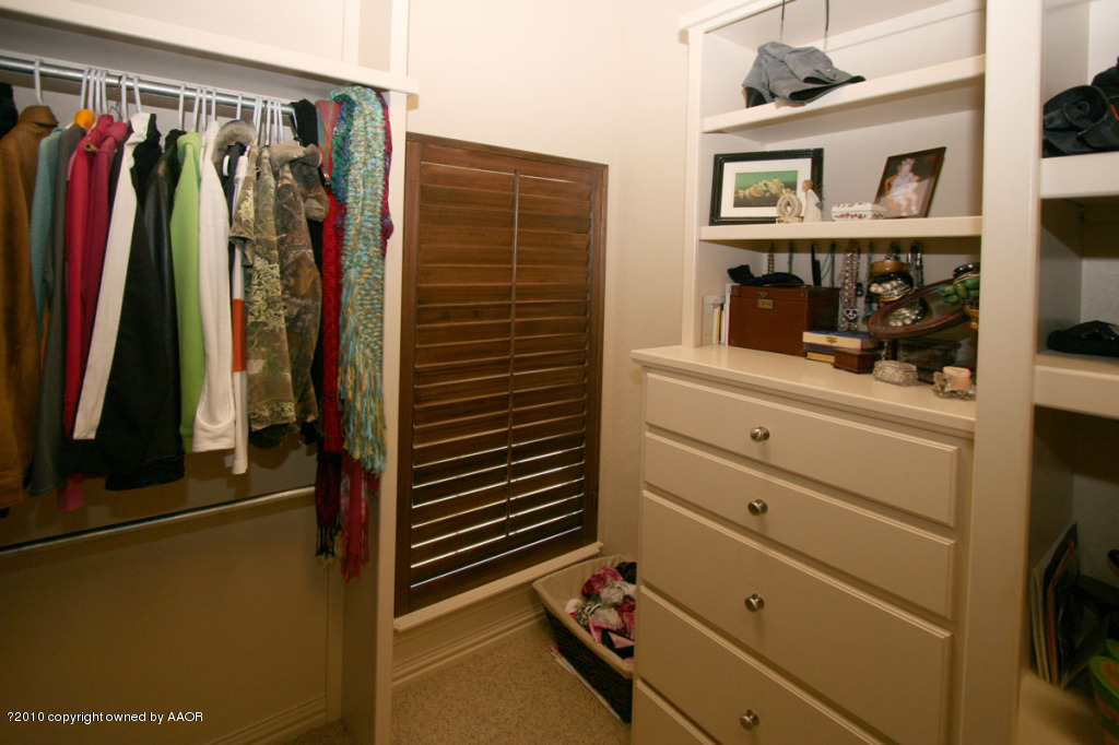 9000 Blackhawk Road Amarillo, TX 79119 - Photo 21 of 39 a view of walk in closet with clothes