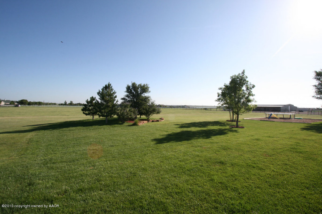 9000 Blackhawk Road Amarillo, TX 79119 - Photo 35 of 39 a view of a lake with houses in the background