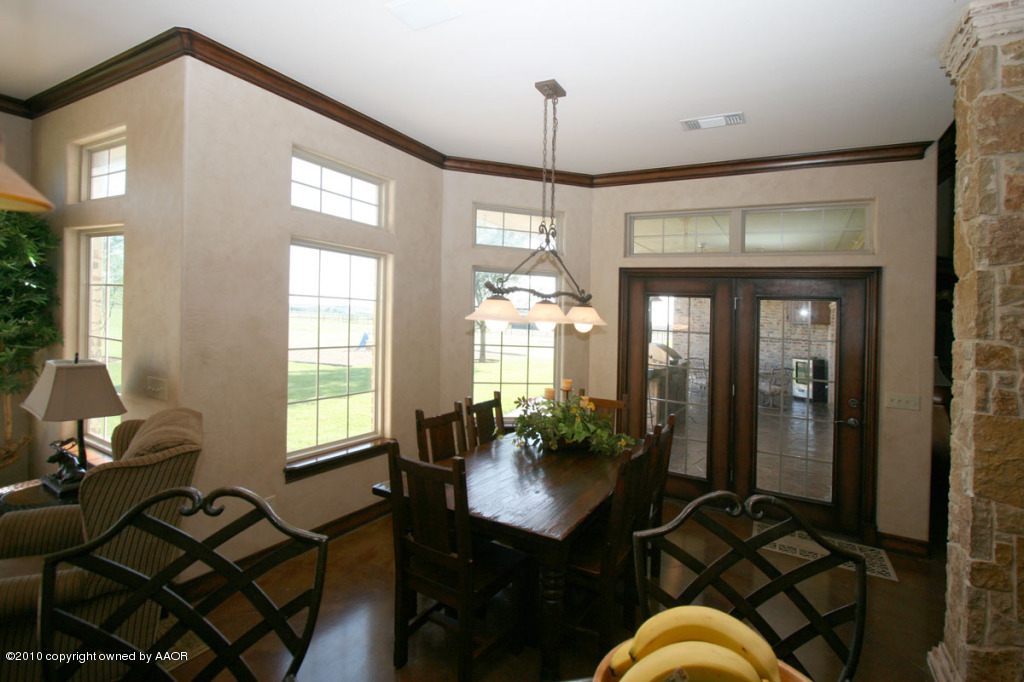 9000 Blackhawk Road Amarillo, TX 79119 - Photo 10 of 39 a workspace with furniture window and wooden floor