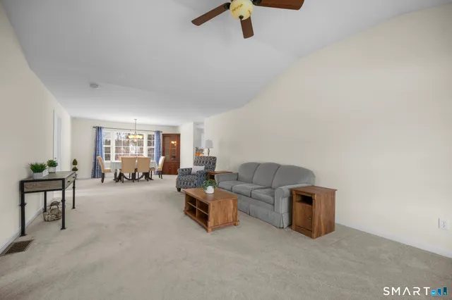 a living room with furniture and a window