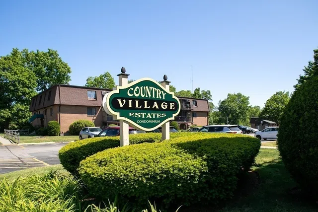 a wooden bench sitting in the middle of a park