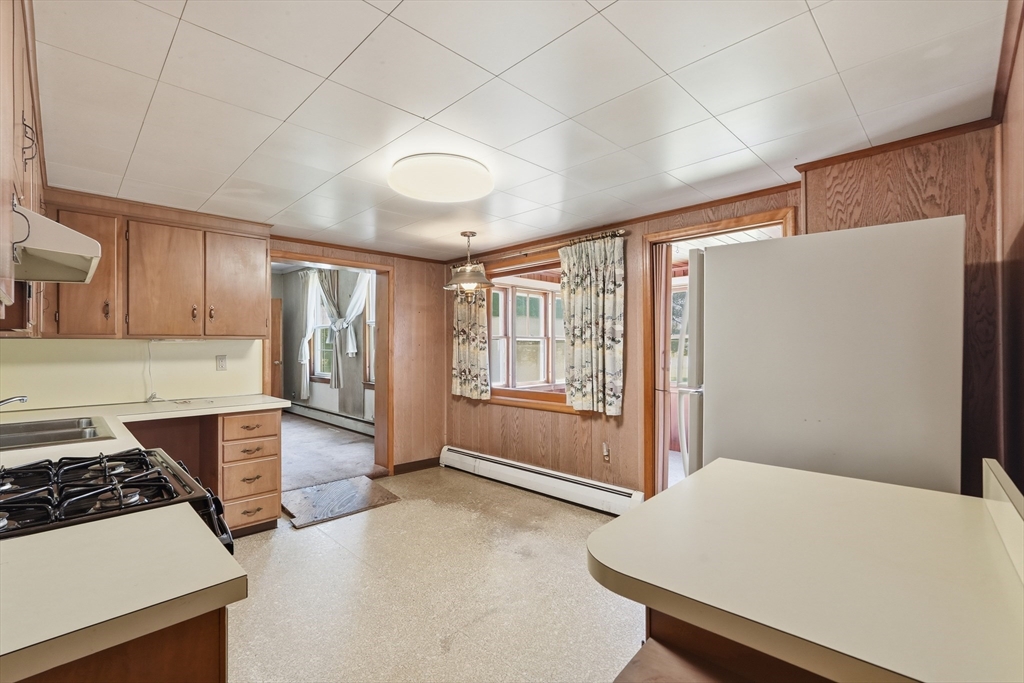 15 Main Street Hatfield, MA 01038 - Photo 10 of 42 a kitchen with a stove a refrigerator and cabinets
