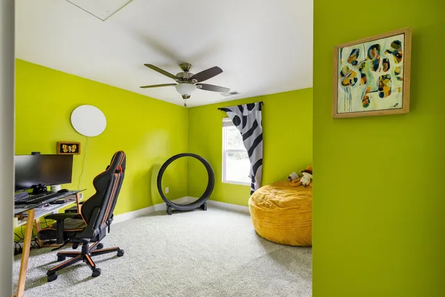 a bed room with a bed and a chair