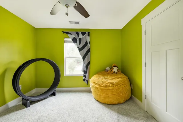 a bathroom with a sink vanity granite tub shower and a toilet