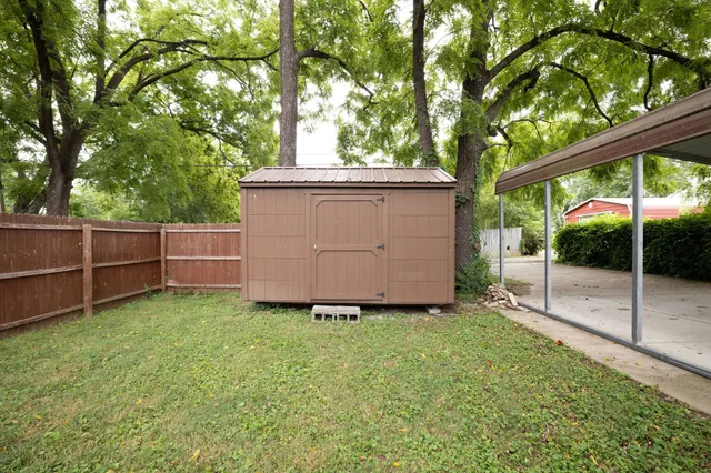 a view of a bathroom with a sink and glass door