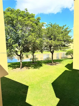 a view of yard with swimming pool