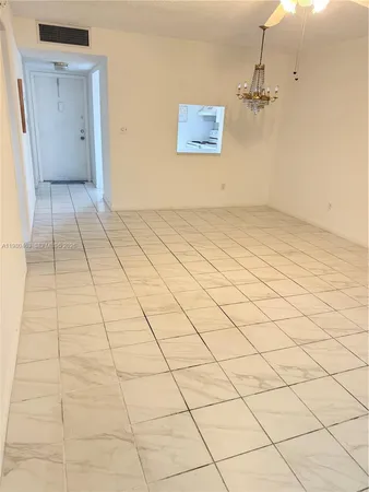 a view of a room with white walls