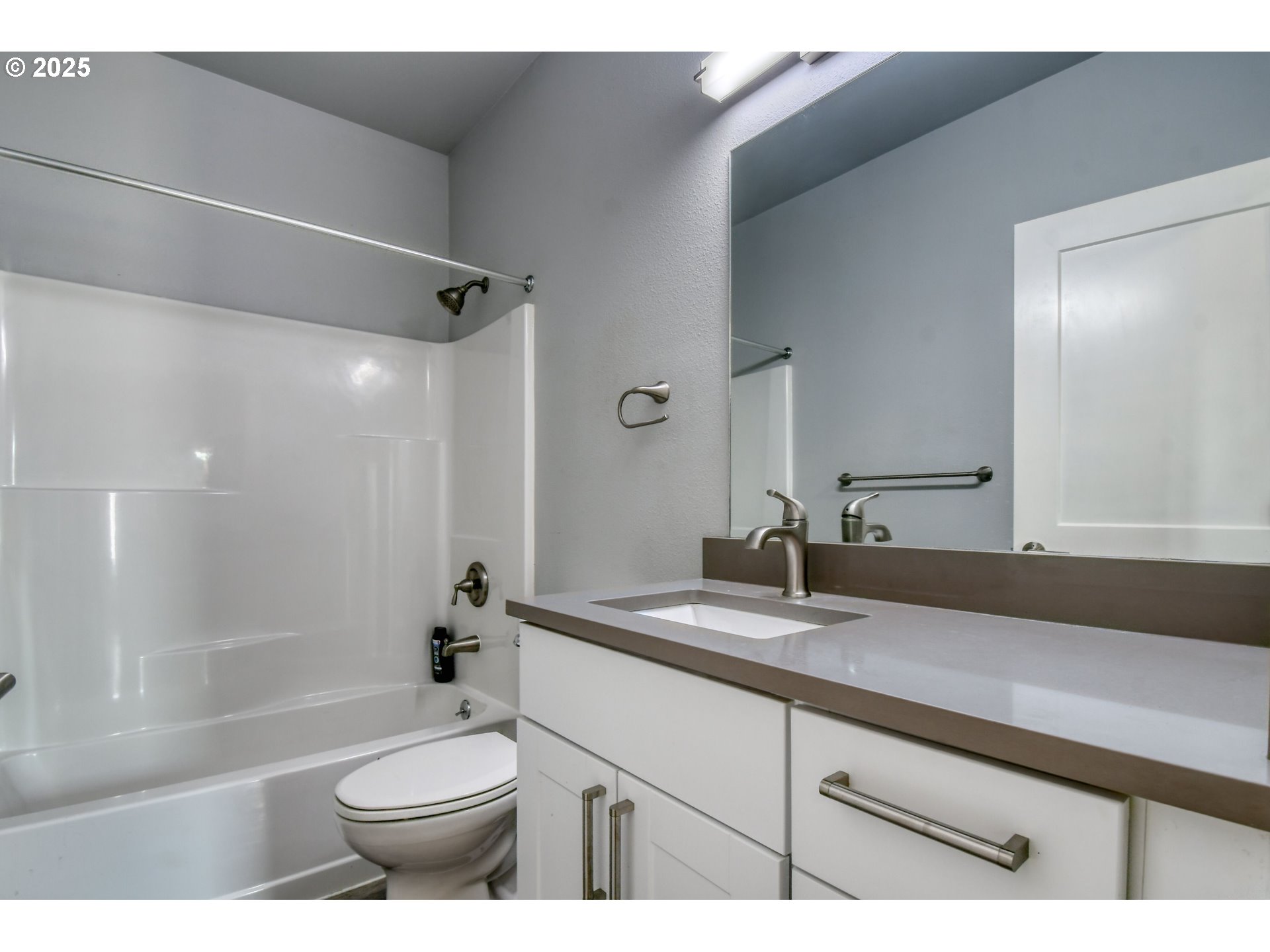 1408 Southwest Frazer Avenue Pendleton, OR 97801 - Photo 13 of 24 a bathroom with a bathtub shower sink vanity mirror and toilet
