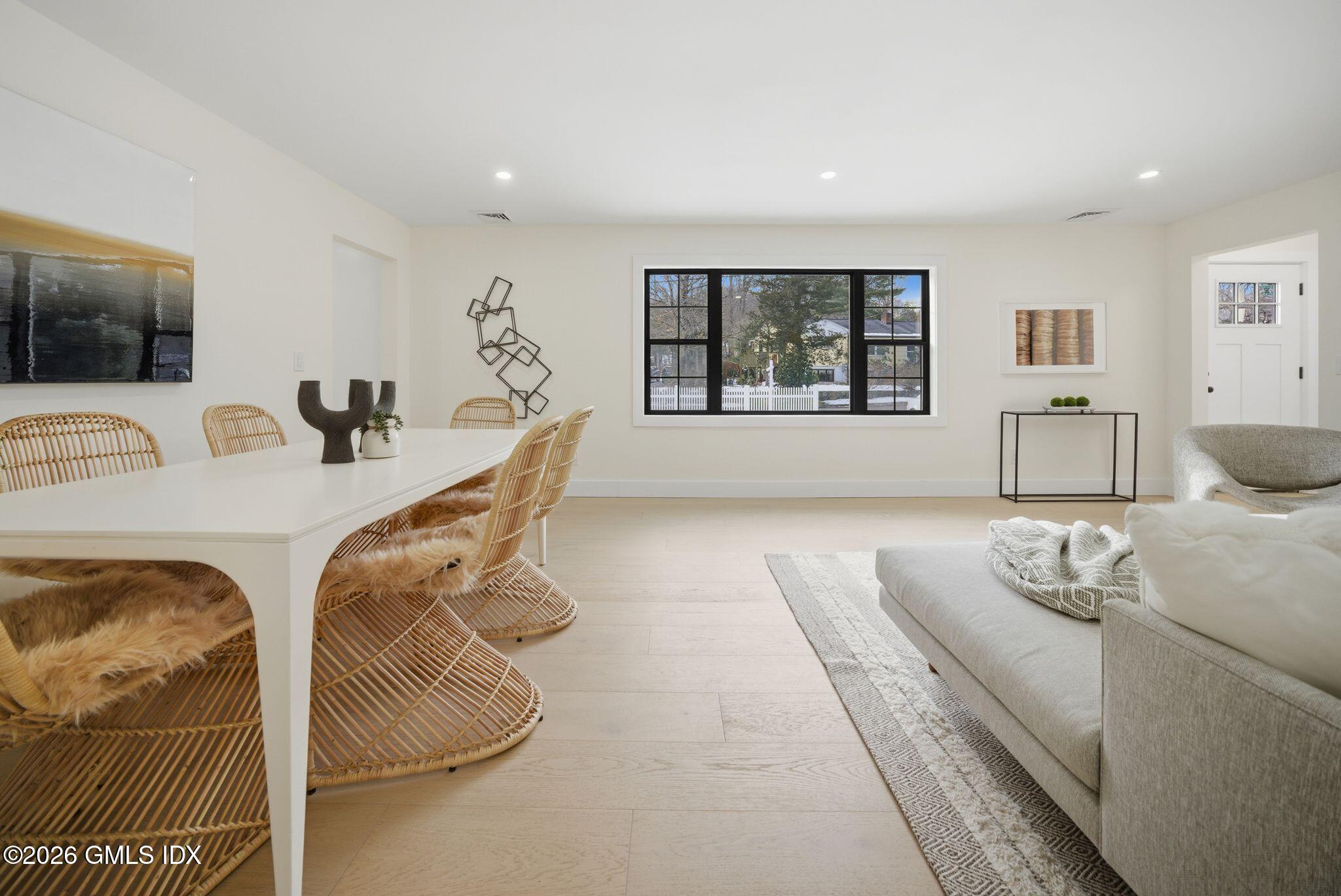 101 Parade Hill Road New Canaan, CT 06840 - Photo 18 of 40 a living room with furniture and floor to ceiling window