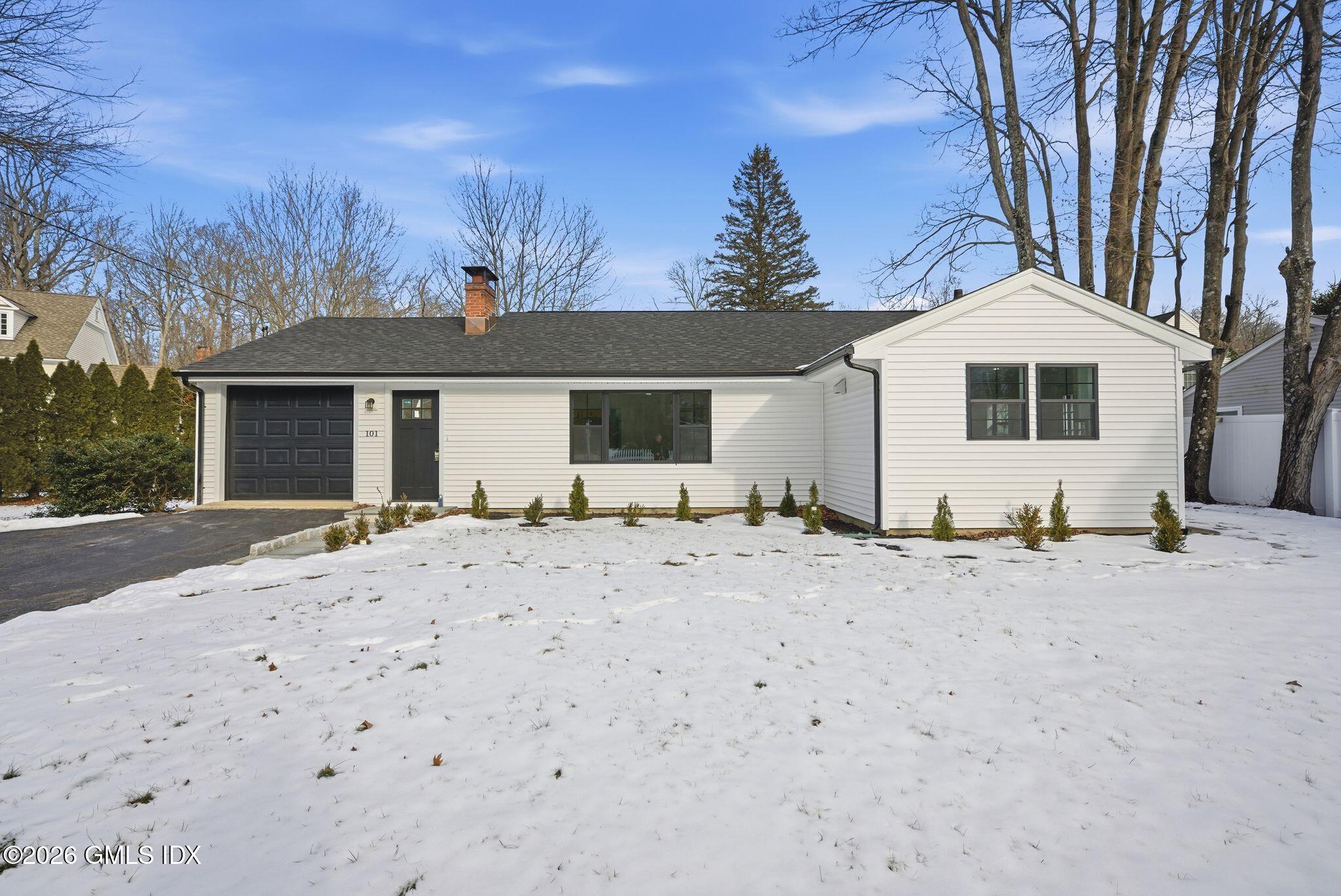 101 Parade Hill Road New Canaan, CT 06840 - Photo 2 of 40 a front view of a house with a yard