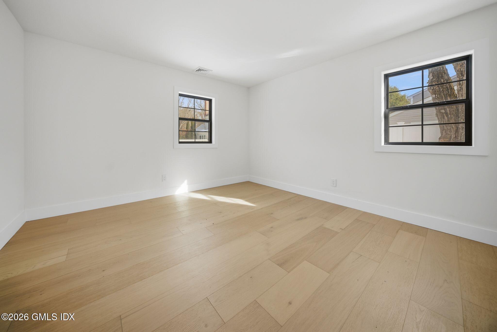 101 Parade Hill Road New Canaan, CT 06840 - Photo 28 of 40 an empty room with windows