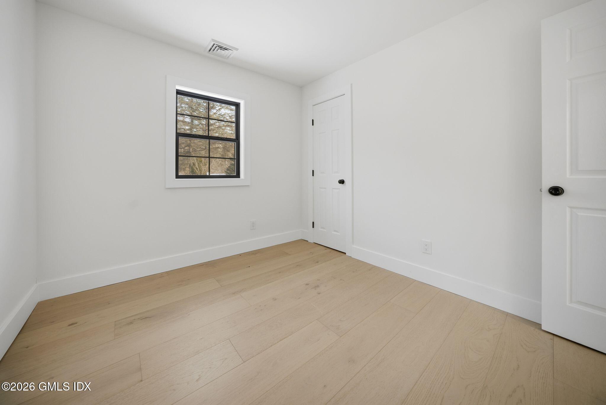 101 Parade Hill Road New Canaan, CT 06840 - Photo 33 of 40 an empty room with windows