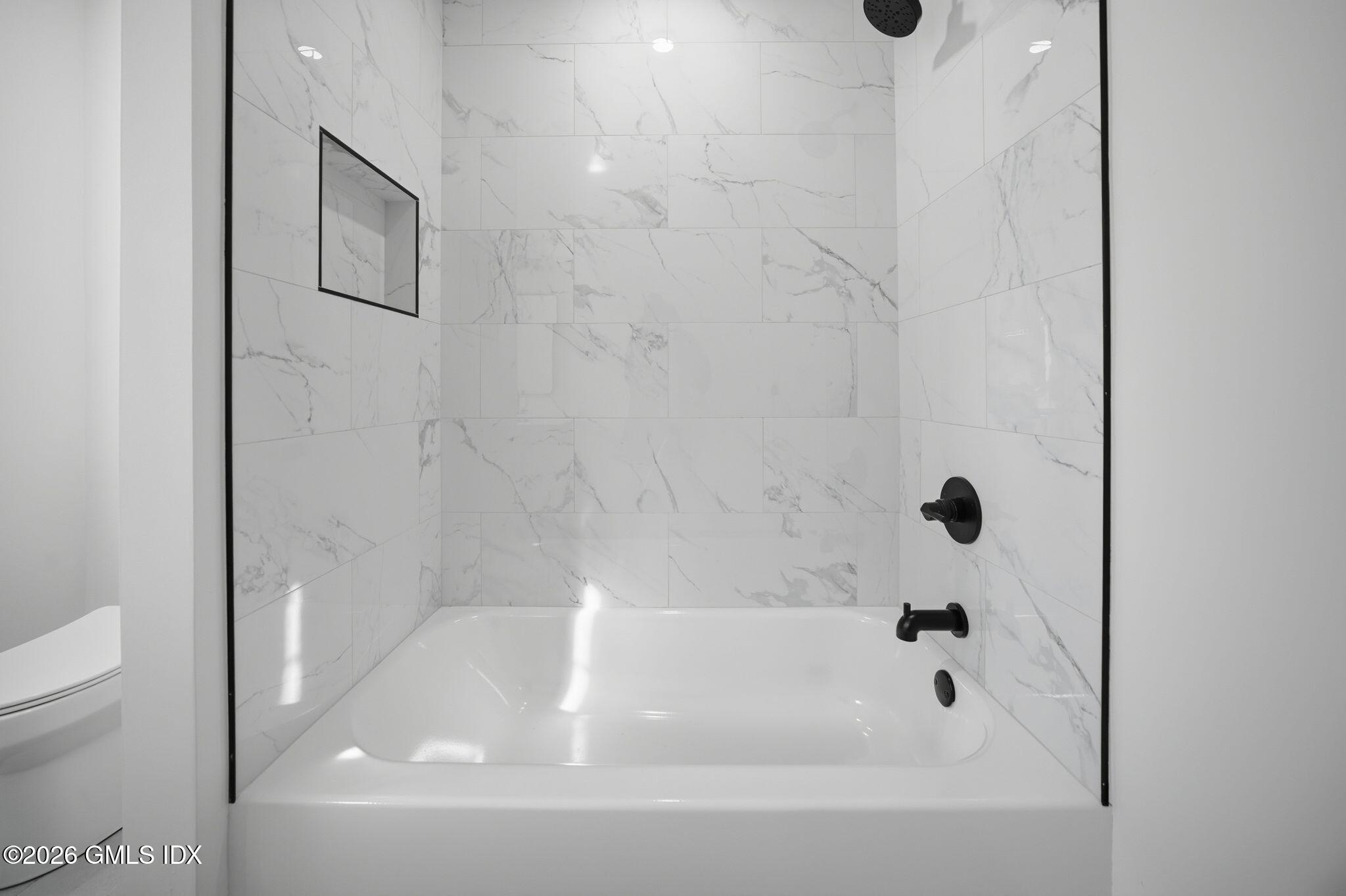 101 Parade Hill Road New Canaan, CT 06840 - Photo 36 of 40 a bathroom with a bathtub