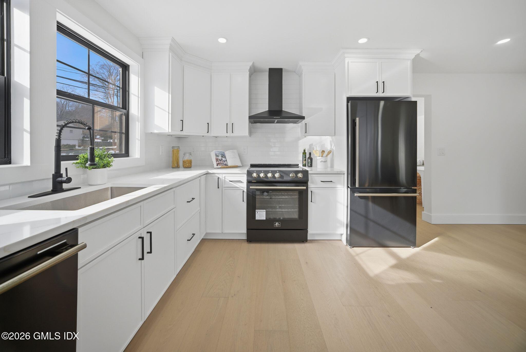101 Parade Hill Road New Canaan, CT 06840 - Photo 6 of 40 a kitchen with granite countertop a refrigerator and a sink