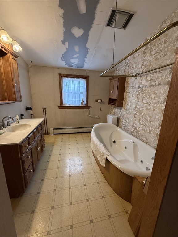 3 Ferry Road Haverhill, MA 01835 - Photo 19 of 30 a bathroom with a sink a toilet and mirror