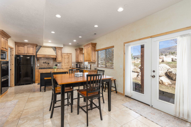 5168 Fairview Loop, Unit C604 Eden, UT 84310 - Photo 10 of 53 Dining room featuring french doors, light tile patterned floors, and recessed lighting