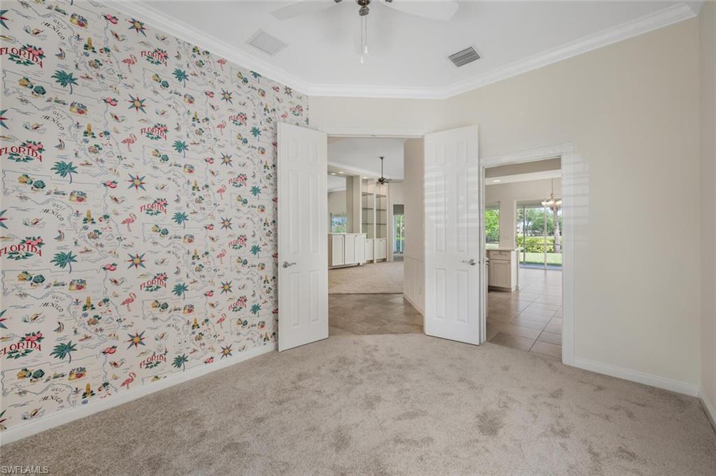 8511 Alessandria Court Naples, FL 34114 - Photo 16 of 45 a view of a hallway to rooms