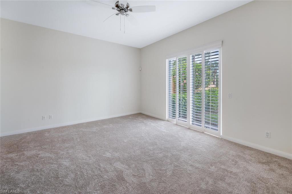 8511 Alessandria Court Naples, FL 34114 - Photo 17 of 45 a view of a livingroom with a ceiling fan and window