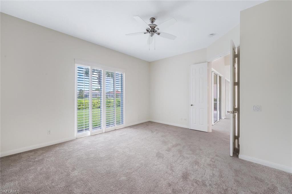 8511 Alessandria Court Naples, FL 34114 - Photo 18 of 45 a view of an empty room with a window