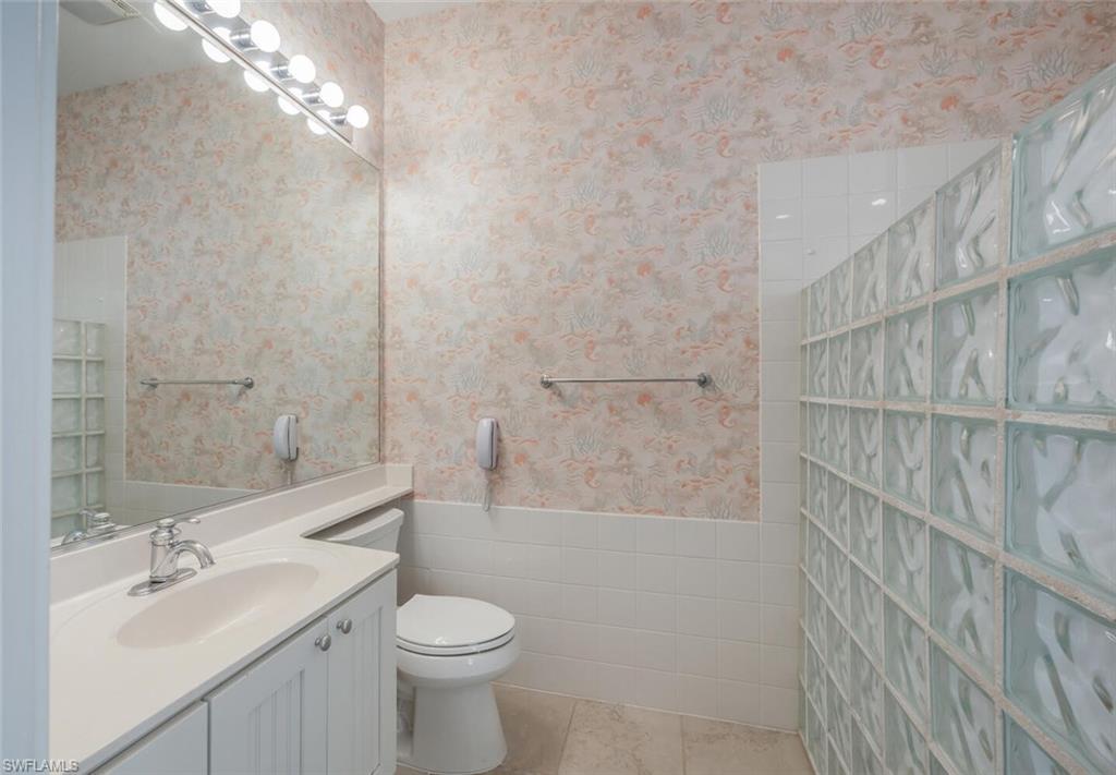 8511 Alessandria Court Naples, FL 34114 - Photo 22 of 45 a bathroom with a sink a toilet and shower