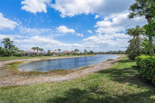a view of a lake with houses in the back