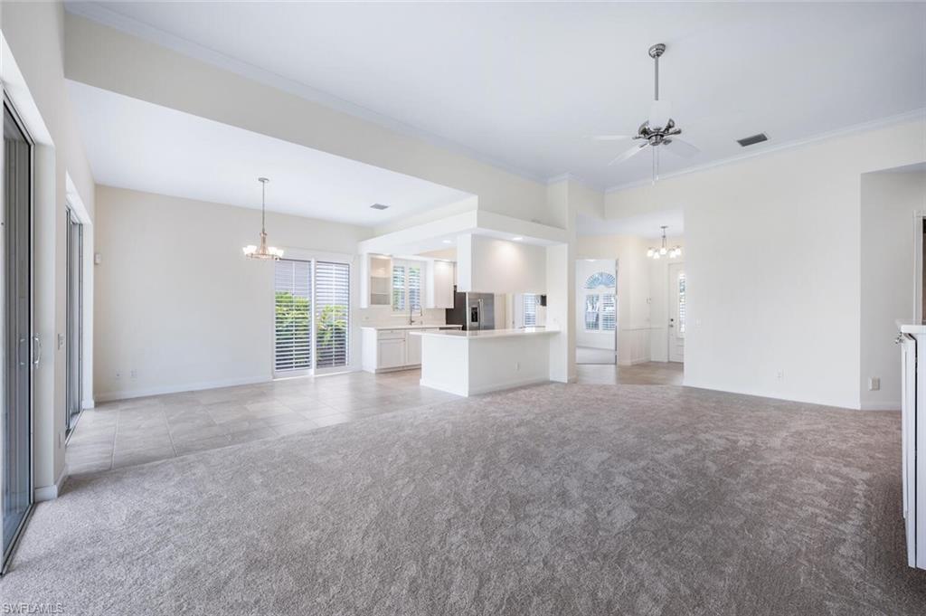 8511 Alessandria Court Naples, FL 34114 - Photo 7 of 45 a view of a kitchen with large windows