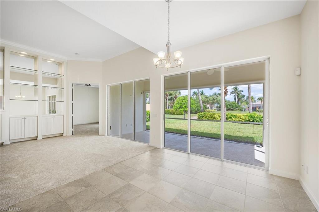 8511 Alessandria Court Naples, FL 34114 - Photo 10 of 45 a view of an empty room with a window