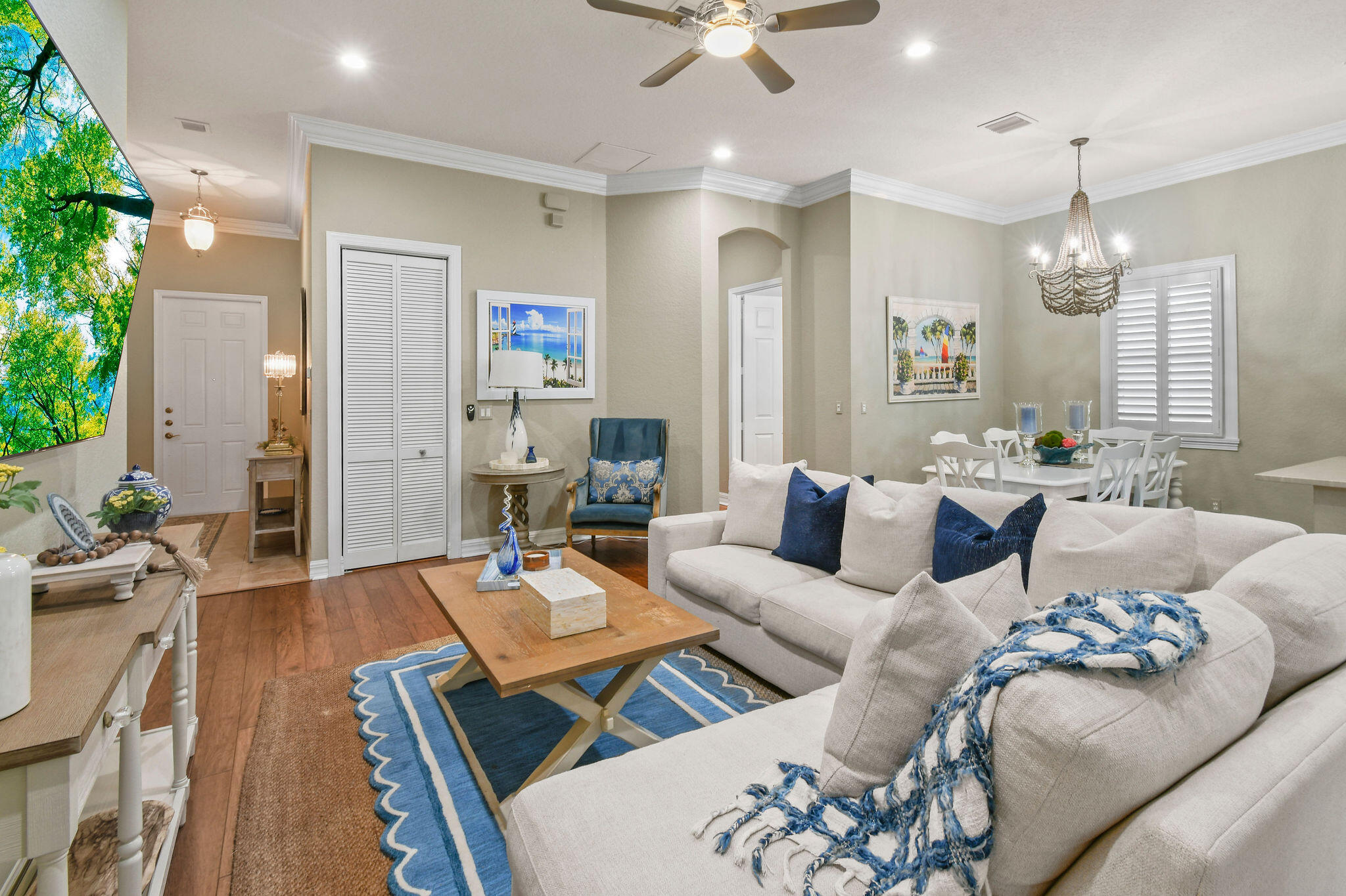 167 Arklow Avenue Jupiter, FL 33458 - Photo 11 of 58 a living room with furniture kitchen view and a chandelier