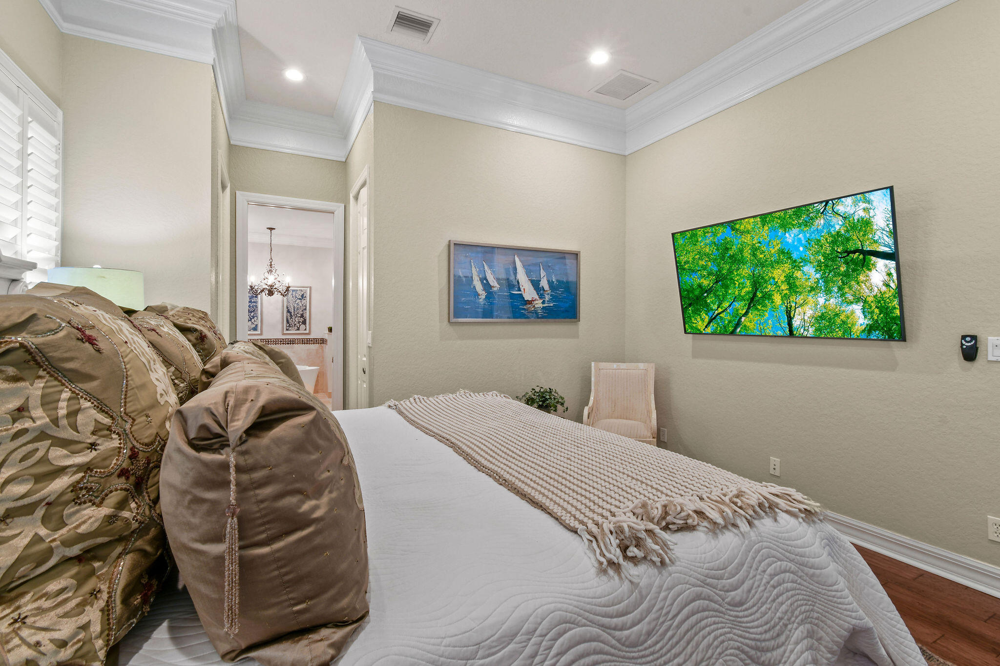 167 Arklow Avenue Jupiter, FL 33458 - Photo 19 of 58 a bedroom with a bed and a painting on the wall