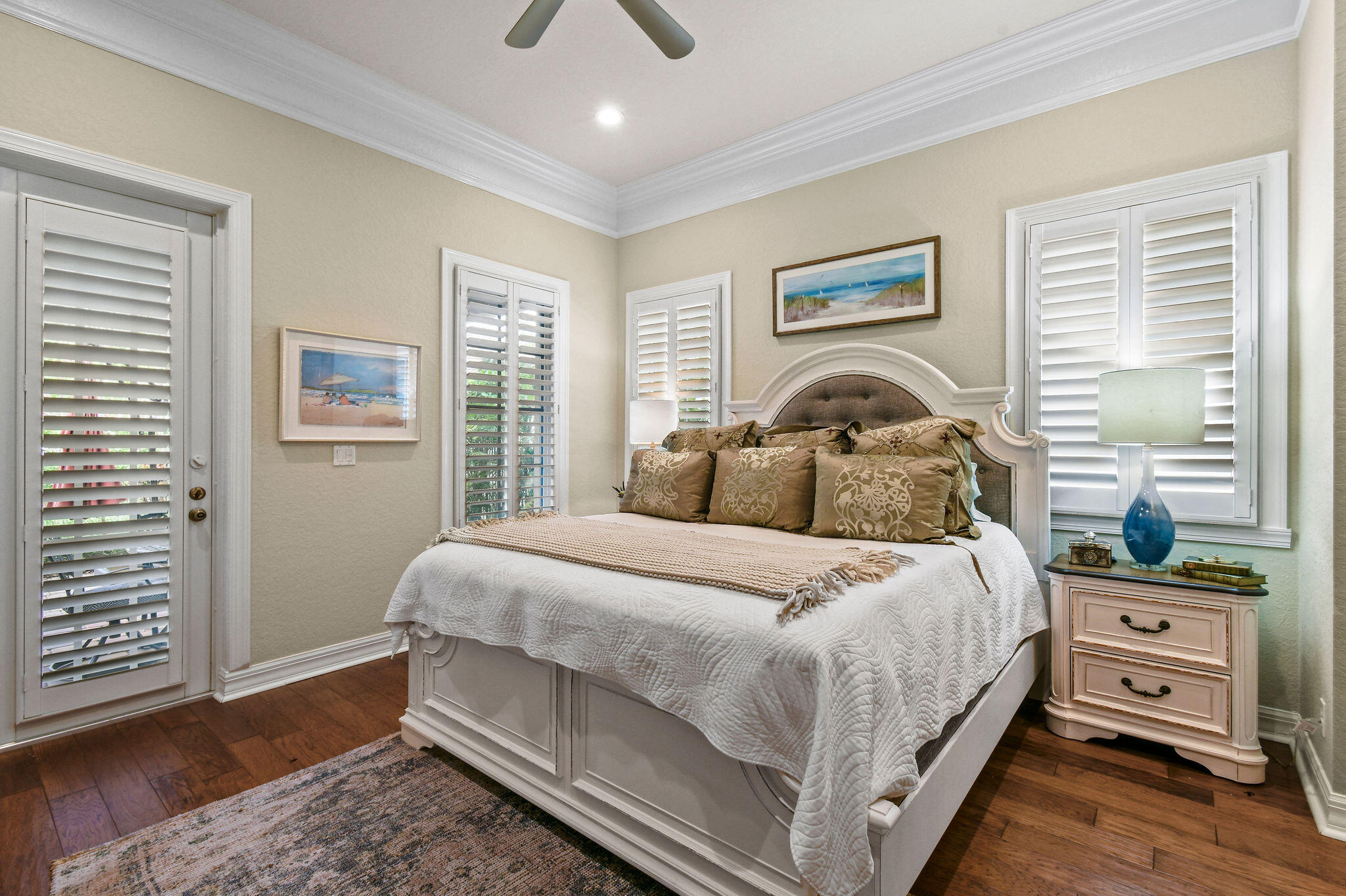 167 Arklow Avenue Jupiter, FL 33458 - Photo 20 of 58 a bedroom with a bed and wooden floor