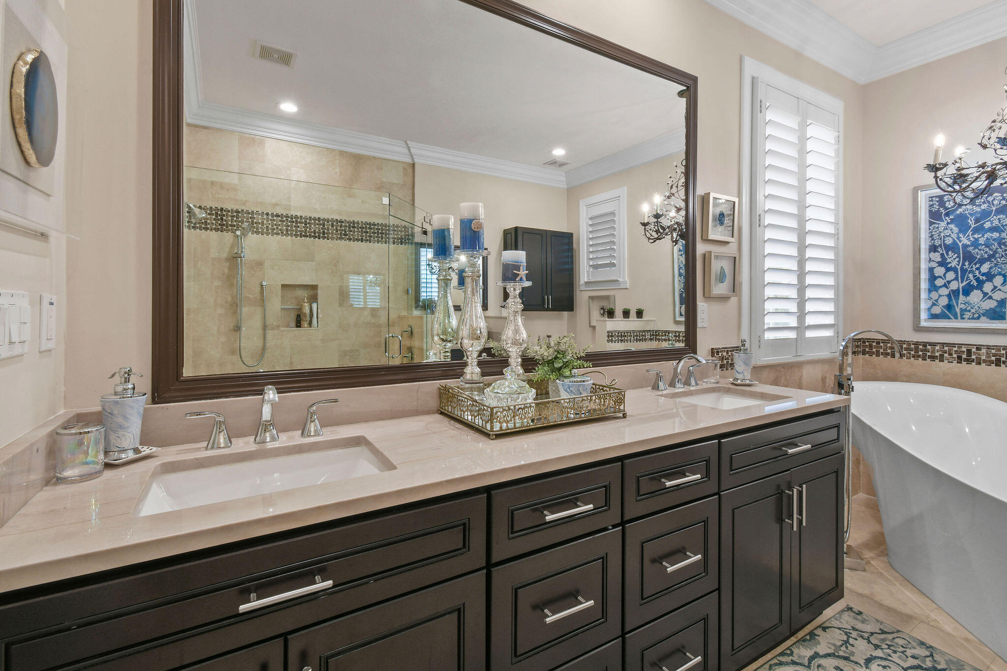 167 Arklow Avenue Jupiter, FL 33458 - Photo 22 of 58 a bathroom with double vanity sinks and a large mirror
