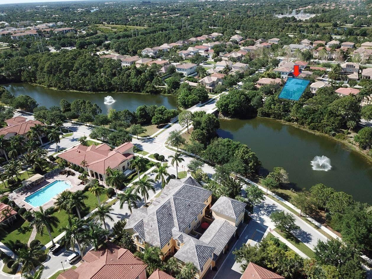 167 Arklow Avenue Jupiter, FL 33458 - Photo 3 of 58 an aerial view of residential house with outdoor space and lake view