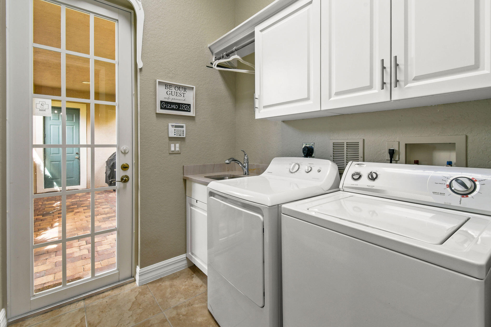 167 Arklow Avenue Jupiter, FL 33458 - Photo 35 of 58 a utility room with dryer and washer