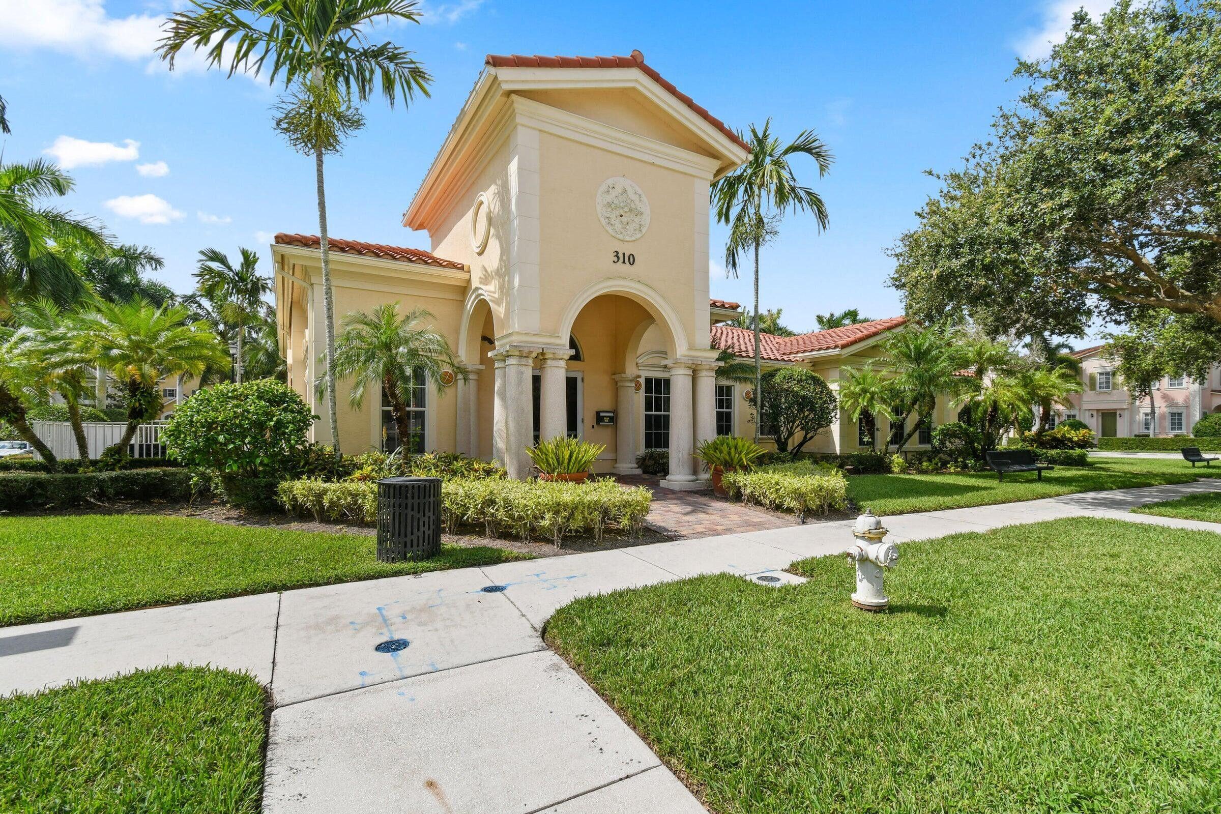 167 Arklow Avenue Jupiter, FL 33458 - Photo 48 of 58 a front view of a house with garden