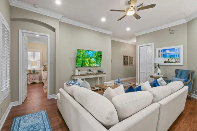a view of a dining room with furniture wooden floor and a chandelier