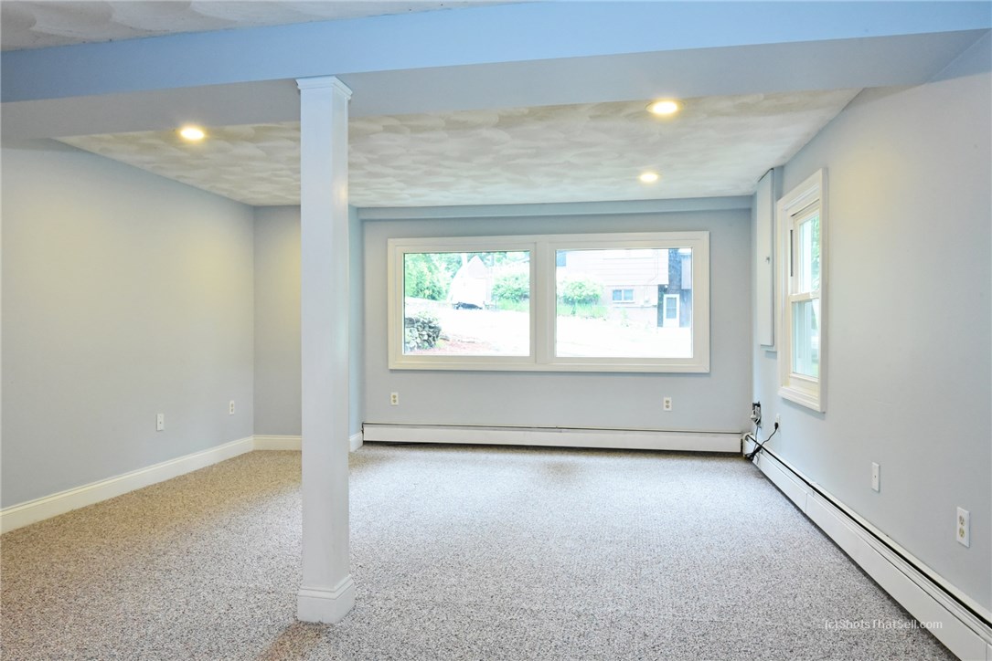25 Edgewood Road Glocester, RI 02814 - Photo 23 of 33 This space in the lower level with it's wonderful natural light can be used as an entertainment area, playroom, etc....it offers many possibilities!