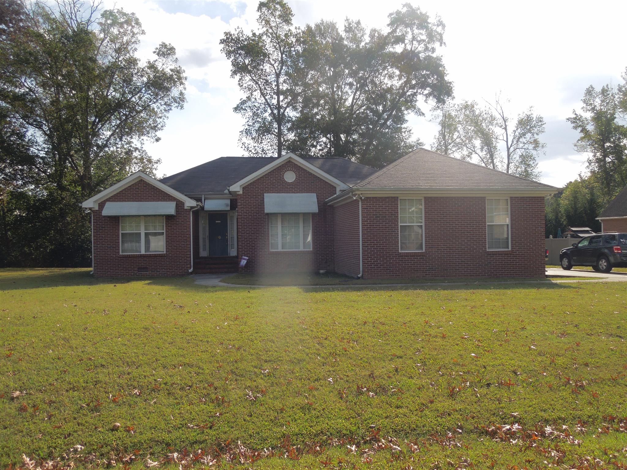 96 Hunt Creek Road Manchester, TN 37355 - Photo 1 of 13 a front view of a house with yard