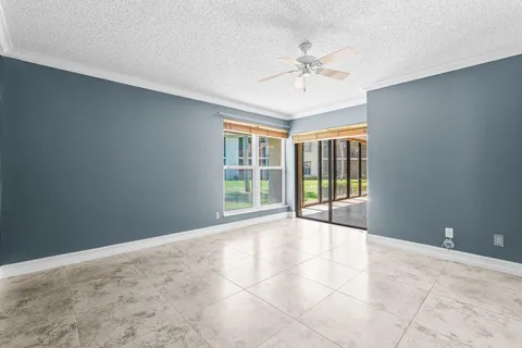 a view of an empty room with a fan