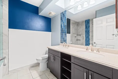 a bathroom with a bathtub and shower