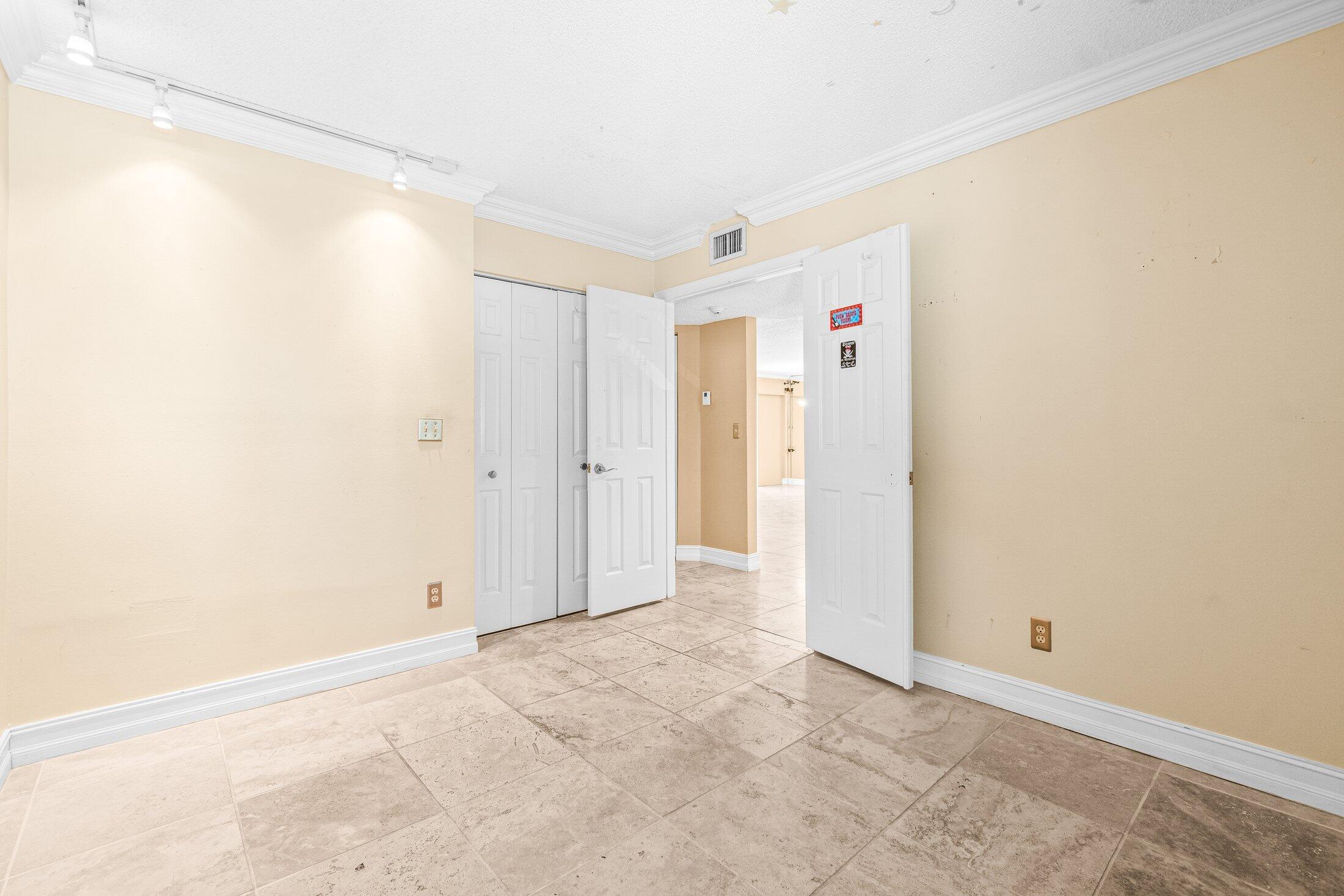 5750 Coach House Circle, Unit C Boca Raton, FL 33486 - Photo 21 of 30 a view of an empty room