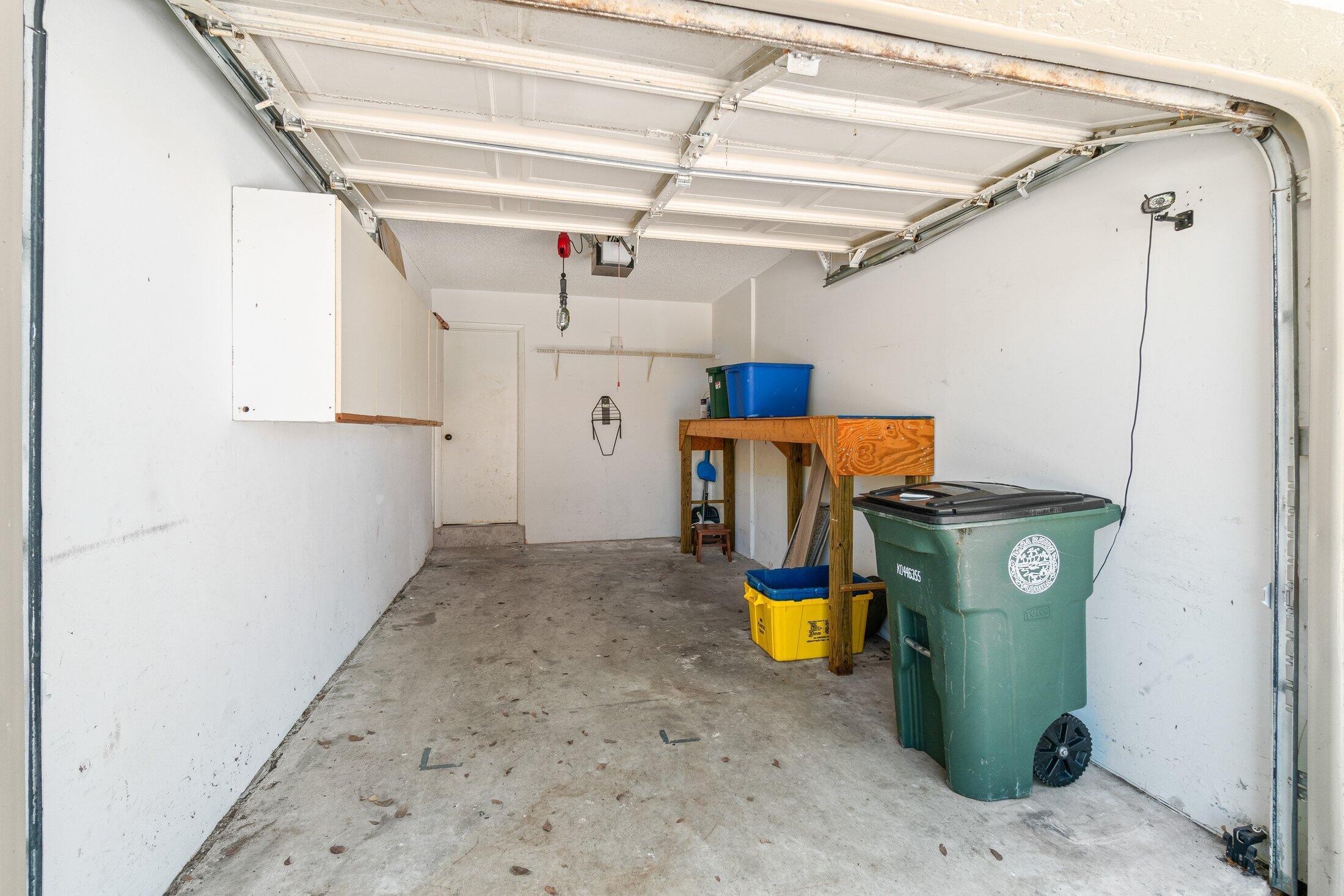 5750 Coach House Circle, Unit C Boca Raton, FL 33486 - Photo 23 of 30 a view of a storage & utility room with refrigerator and windows