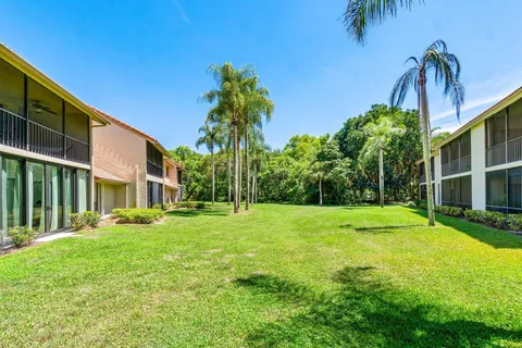 a view of a backyard with swimming pool