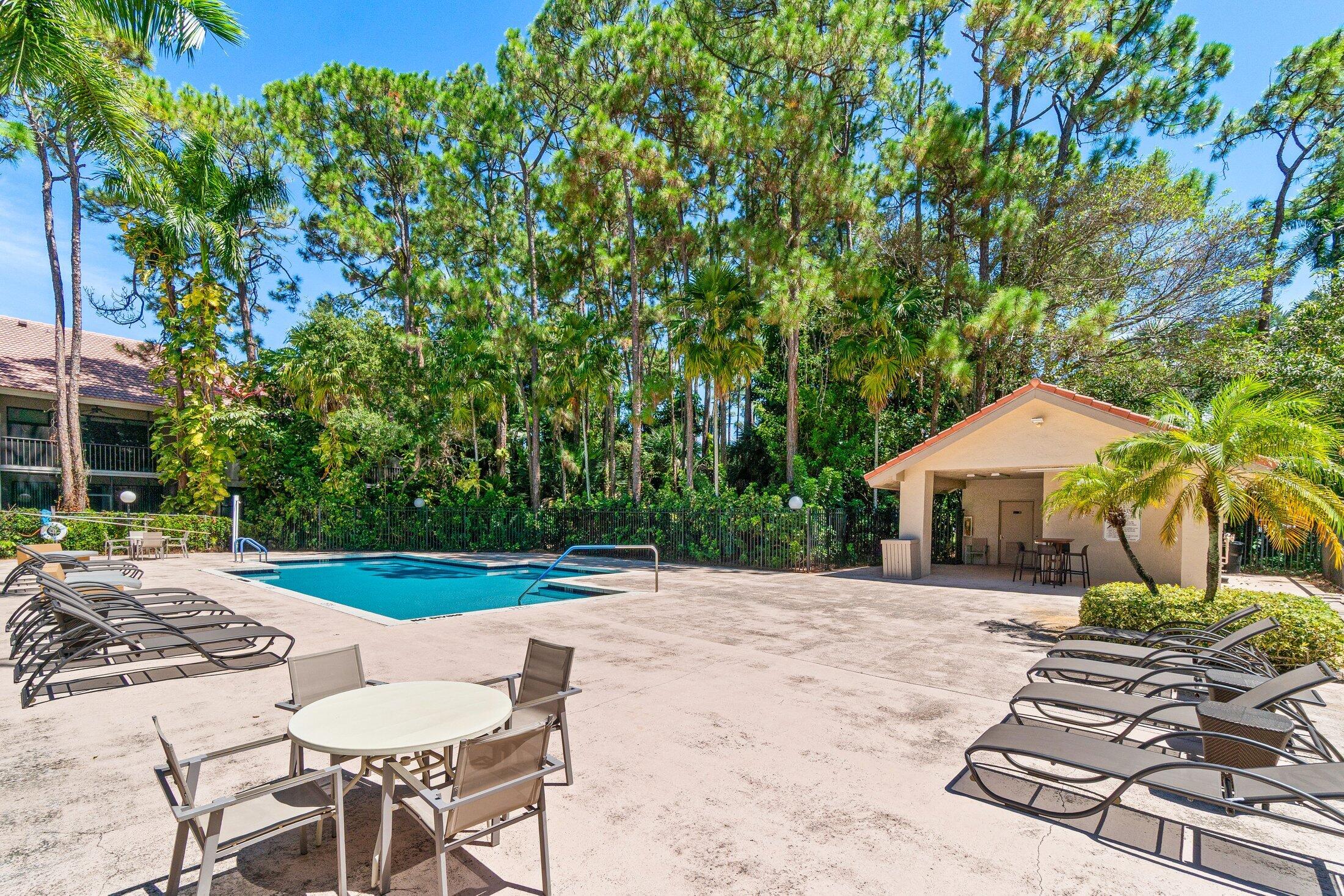 5750 Coach House Circle, Unit C Boca Raton, FL 33486 - Photo 28 of 30 a view of a patio with a yard