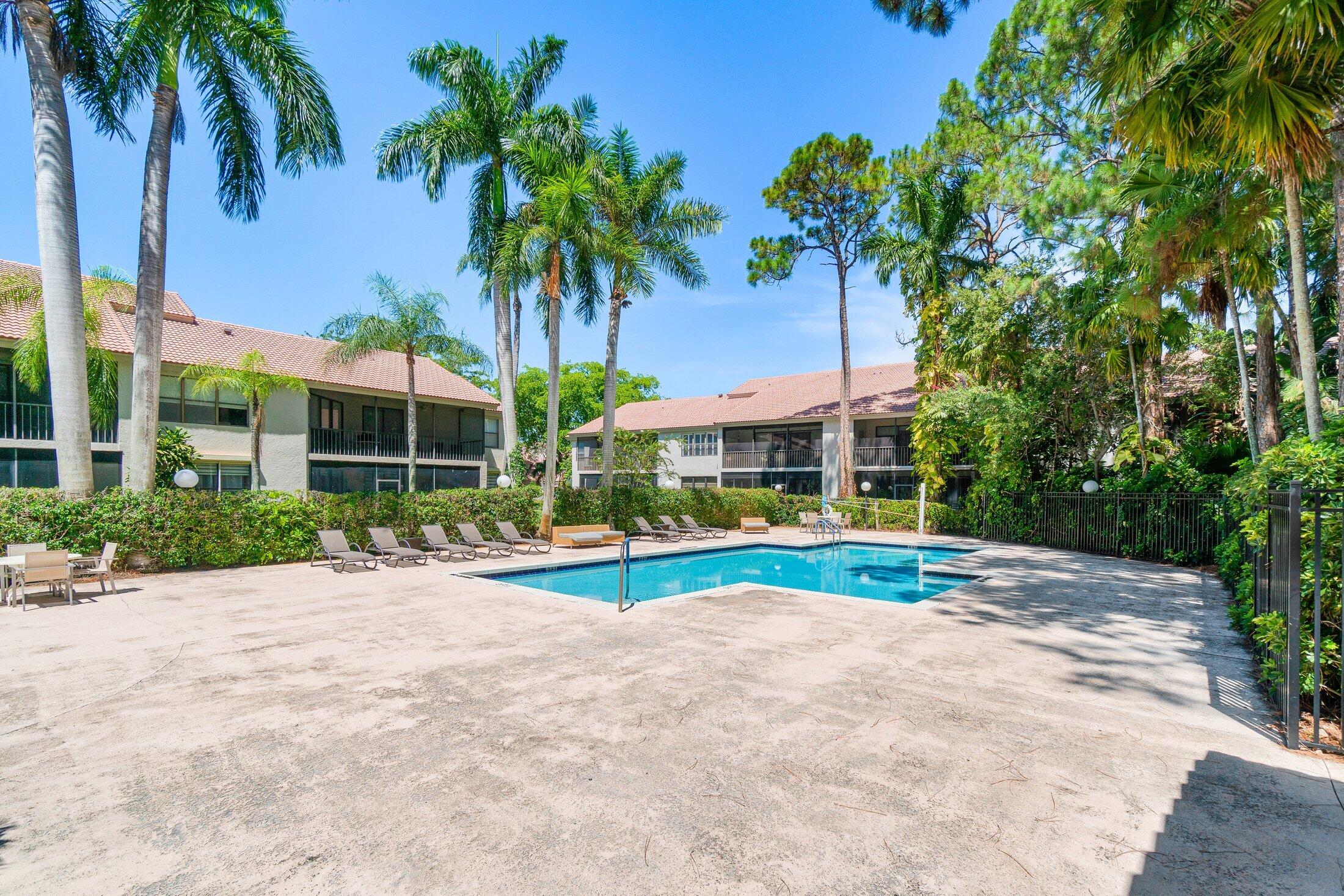 5750 Coach House Circle, Unit C Boca Raton, FL 33486 - Photo 29 of 30 a view of outdoor space yard and porch