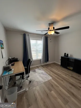 a bedroom with furniture and window