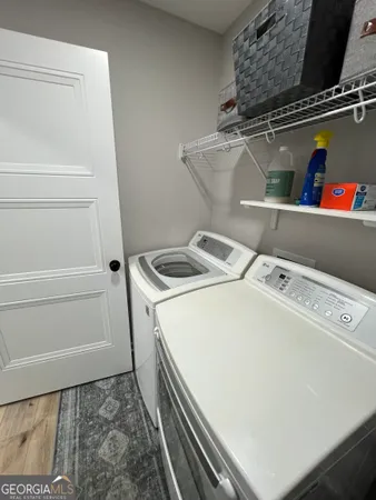a utility room with dryer and washer