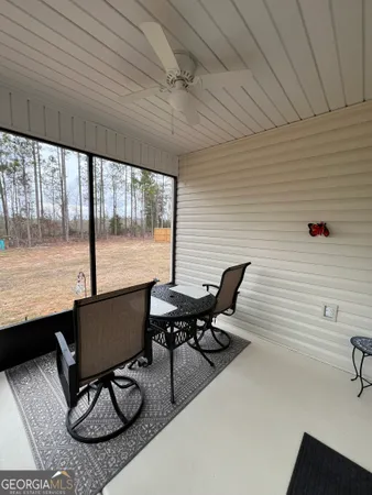 a view of a workspace with furniture